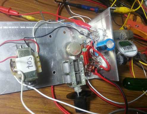 [Experimental radio circuit built on metal plate.]